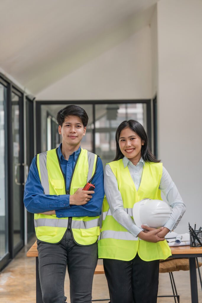 Portrait two engineer asian smileing building contractors standing at office